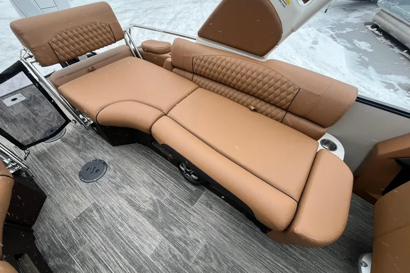 Slide: The Image of Luxurious tan seating in 2026 Avalon Excalibur LTD Quad Lounge boat interior. - 19