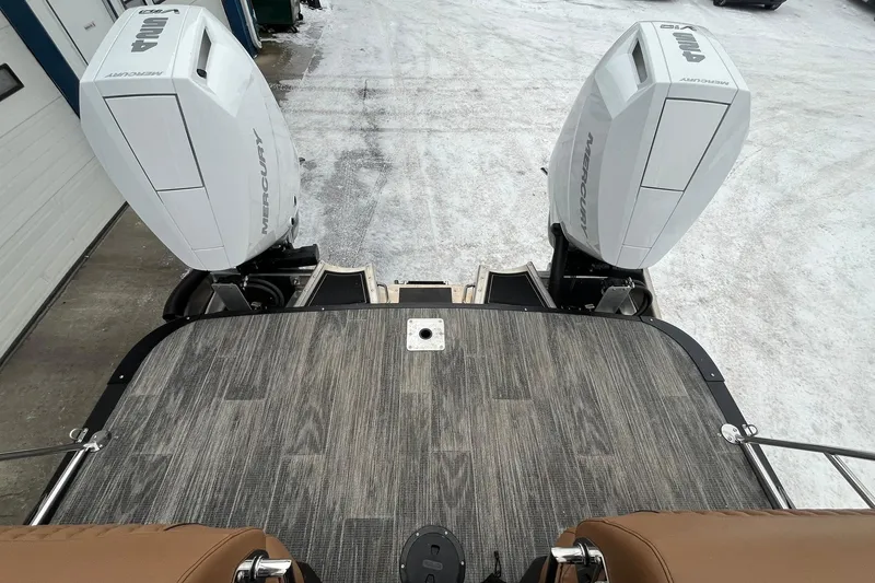 Slide: The Image of 2026 Avalon Excalibur LTD Quad Lounge with dual Mercury outboard engines on snowy ground. - 20