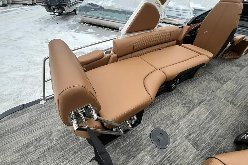 Slide: The Image of Luxurious seating on 2026 Avalon Excalibur LTD Quad Lounge boat, featuring tan upholstery and modern design. - 25
