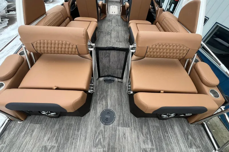 Slide: The Image of Luxurious seating on 2026 Avalon Excalibur LTD Quad Lounge boat with elegant brown upholstery. - 27