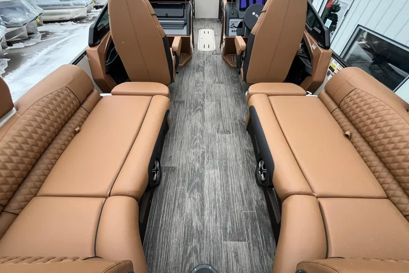 Slide: The Image of Luxurious interior of 2026 Avalon Excalibur LTD Quad Lounge with tan leather seating. - 28