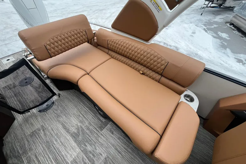 Slide: The Image of Luxurious tan seating in 2026 Avalon Excalibur LTD Quad Lounge boat interior. - 29