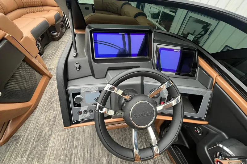 Slide: The Image of 2026 Avalon Excalibur LTD Quad Lounge dashboard with modern steering and dual displays. - 36