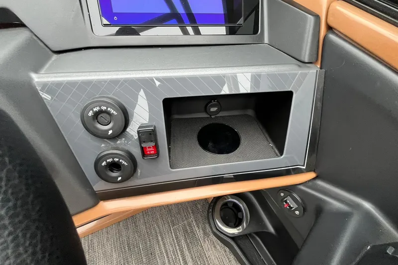 Slide: The Image of Control panel of 2026 Avalon Excalibur LTD Quad Lounge with switches and storage compartment. - 38