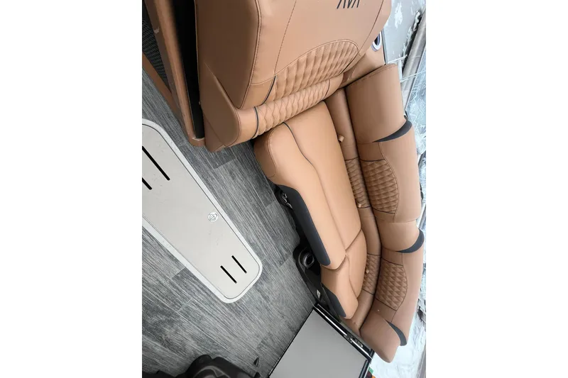 Slide: The Image of Luxurious tan seating in 2026 Avalon Excalibur LTD Quad Lounge boat interior. - 43