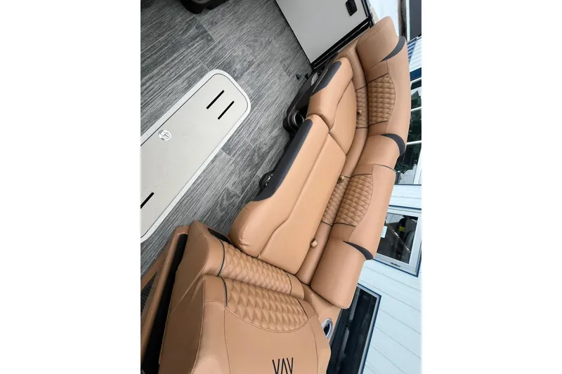 Slide: The Image of Luxurious tan seating in 2026 Avalon Excalibur LTD Quad Lounge boat interior. - 44
