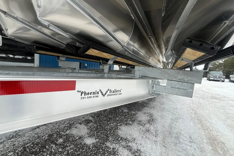 Slide: The Image of Trailer for 2026 Avalon Excalibur LTD Quad Lounge on snowy ground. - 8