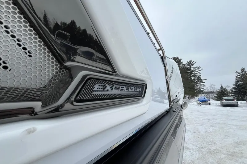 Slide: The Image of 2026 Avalon Excalibur LTD Quad Lounge boat detail in snowy outdoor setting. - 9