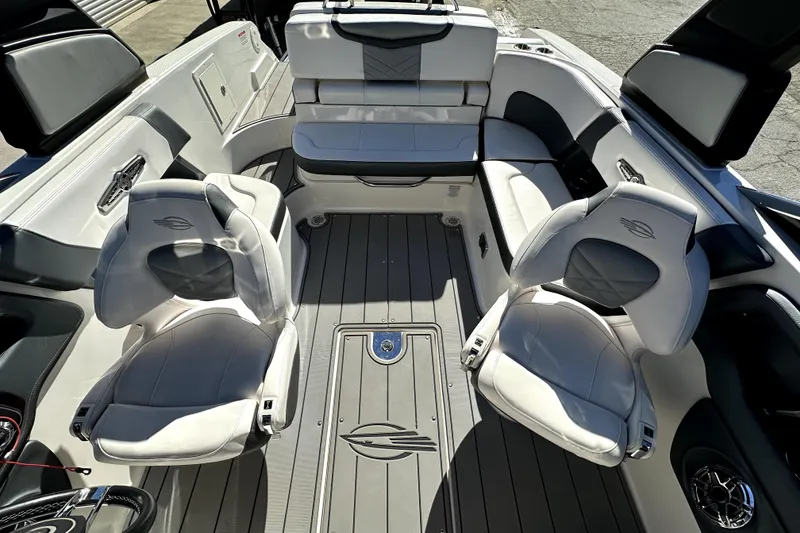 Slide: The Image of 2021 Chaparral 26 Surf boat interior with luxurious seating and modern design. - 12