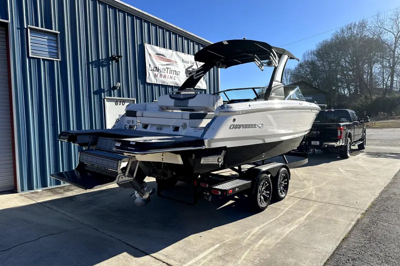Slide: The Image of 2021 Chaparral 26 Surf boat on trailer outside marine shop. - 4
