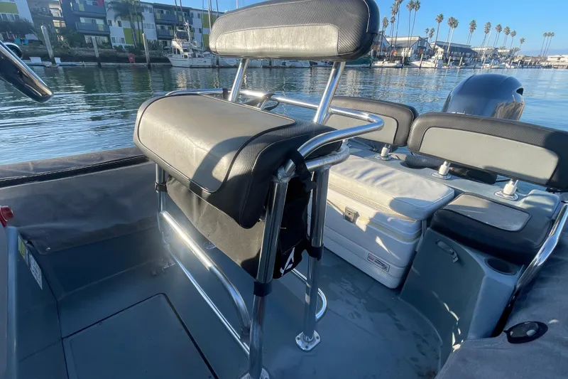 Slide: The Image of 2016 Zodiac Pro Classic 650 boat interior with seating and waterfront view. - 10