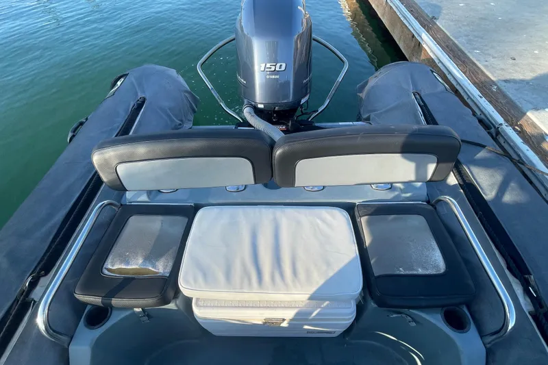 Slide: The Image of 2016 Zodiac Pro Classic 650 boat with Yamaha 150 engine, docked at marina. - 12