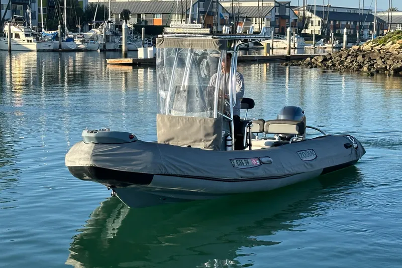 Slide: The Image of 2016 Zodiac Pro Classic 650 boat in marina, calm water, clear day. - 3