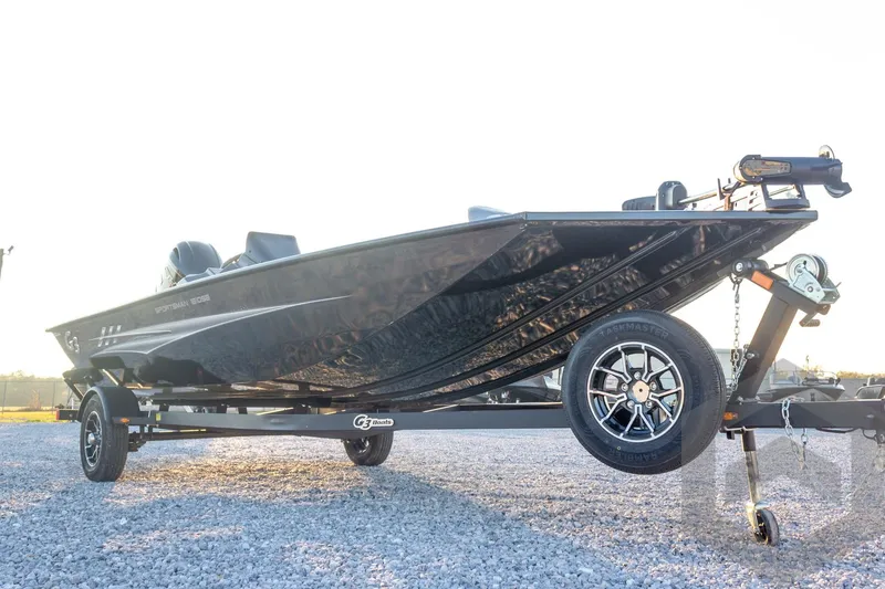 Slide: The Image of 2026 G3 Sportsman 1810 SE boat on trailer, parked on gravel surface. - 11