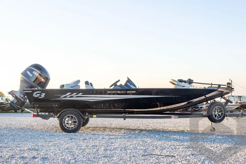 Slide: The Image of 2026 G3 Sportsman 1810 SE boat on trailer, side view, outdoors. - 12