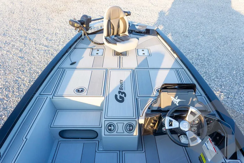 Slide: The Image of 2026 G3 Sportsman 1810 SE boat interior with steering wheel and seating. - 18