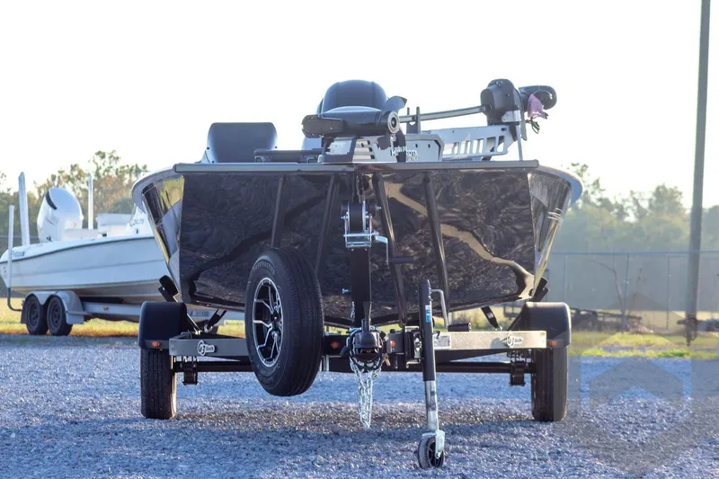 Slide: The Image of 2026 G3 Sportsman 1810 SE boat on trailer, parked outdoors. - 2