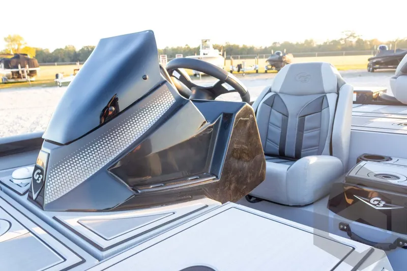 Slide: The Image of 2026 G3 Sportsman 1810 SE boat interior with steering wheel and seating. - 24