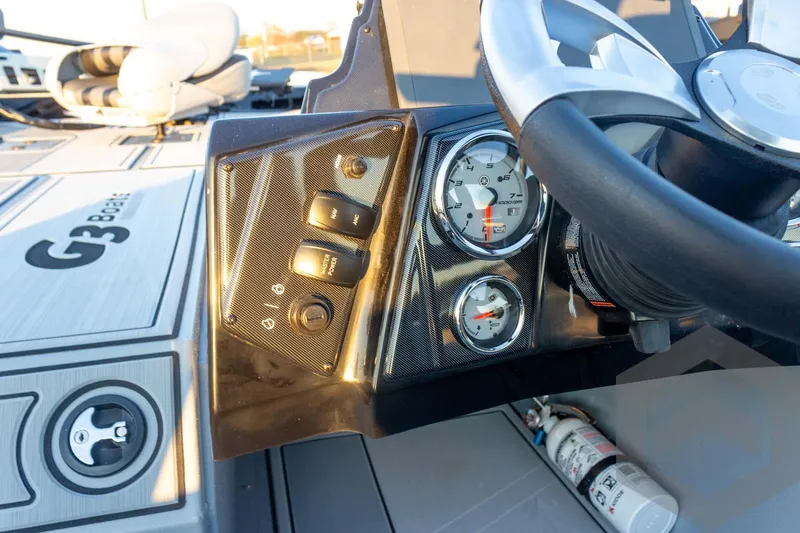 Slide: The Image of 2026 G3 Sportsman 1810 SE boat dashboard with steering wheel and gauges. - 30