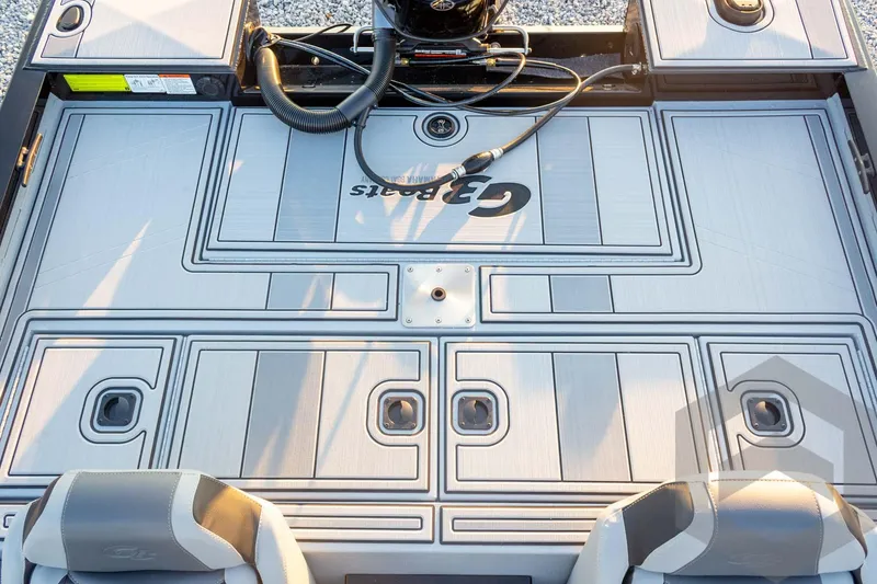 Slide: The Image of 2026 G3 Sportsman 1810 SE boat deck with storage compartments and seating. - 31