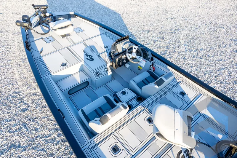 Slide: The Image of 2026 G3 Sportsman 1810 SE boat interior with modern seating and steering console. - 52