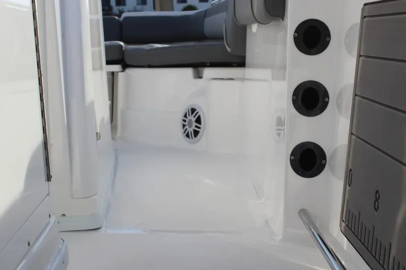 Slide: The Image of 2025 NauticStar 251 Hybrid boat interior with seating and rod holders. - 16
