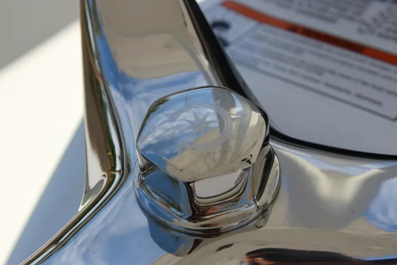 Slide: The Image of Close-up of 2025 NauticStar 251 Hybrid boat's polished chrome detail. - 19