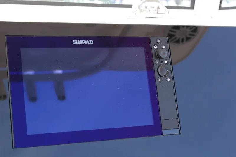 Slide: The Image of Simrad display on 2025 NauticStar 251 Hybrid boat, showcasing navigation technology. - 20