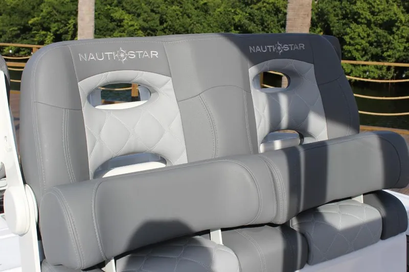 Slide: The Image of 2025 NauticStar 251 Hybrid boat seats with gray upholstery and quilted design. - 23