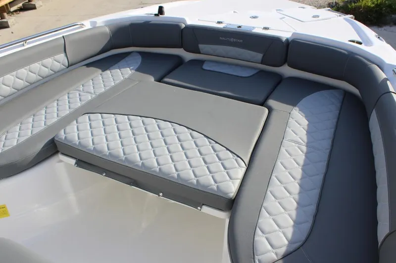Slide: The Image of 2025 NauticStar 251 Hybrid boat interior with gray quilted seating. - 25