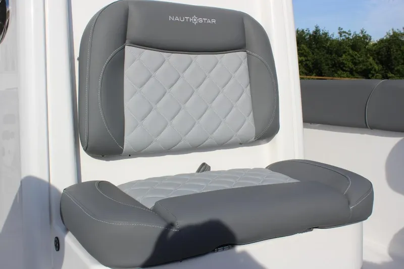 Slide: The Image of 2025 NauticStar 251 Hybrid boat seat with gray quilted upholstery. - 27