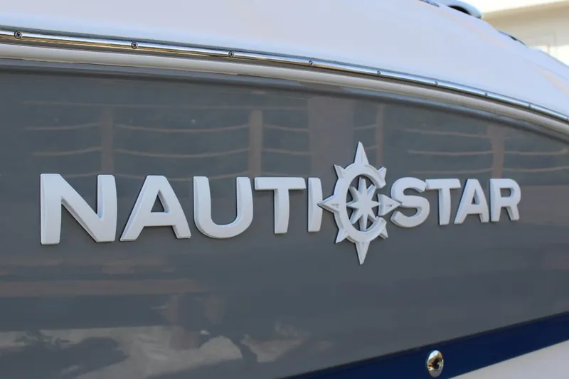 Slide: The Image of 2025 NauticStar 251 Hybrid boat logo on sleek hull. - 6