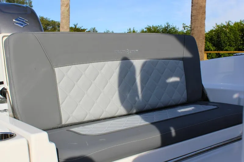 Slide: The Image of 2025 NauticStar 251 Hybrid boat seat with quilted gray upholstery. - 9