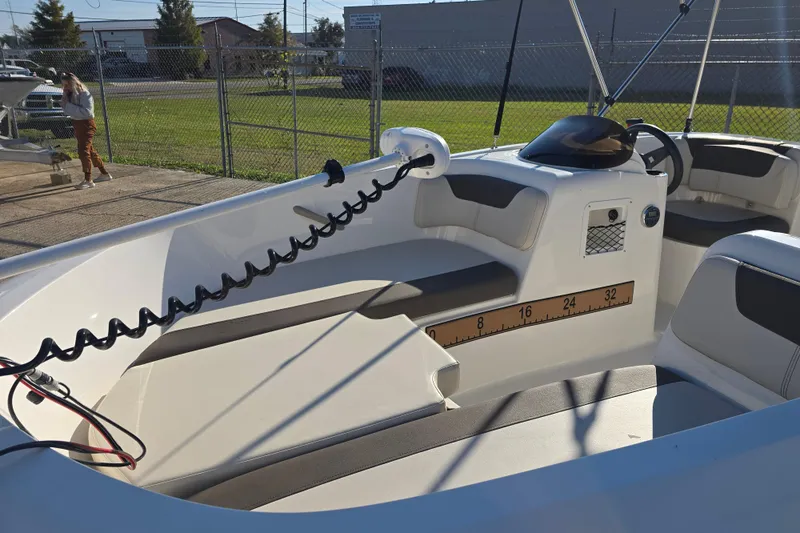 Slide: The Image of 2019 Bayliner Element E16 boat interior with seating and steering wheel. - 11