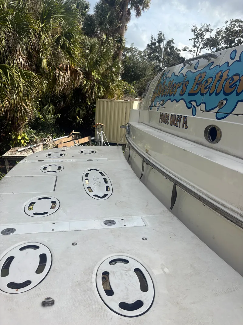 Slide: The Image of Sea Ray Five Forty boat from 2001 parked outdoors. - 13