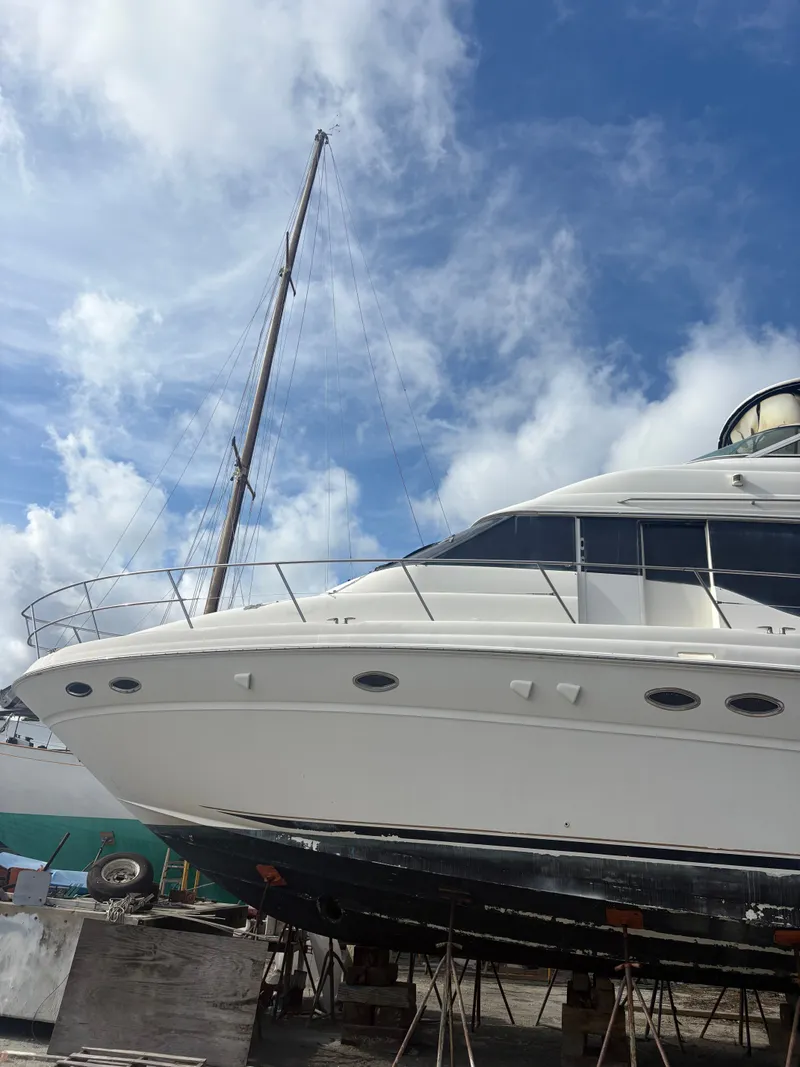 Slide: The Image of 2001 Sea Ray Five Forty yacht in dry dock under blue sky. - 2