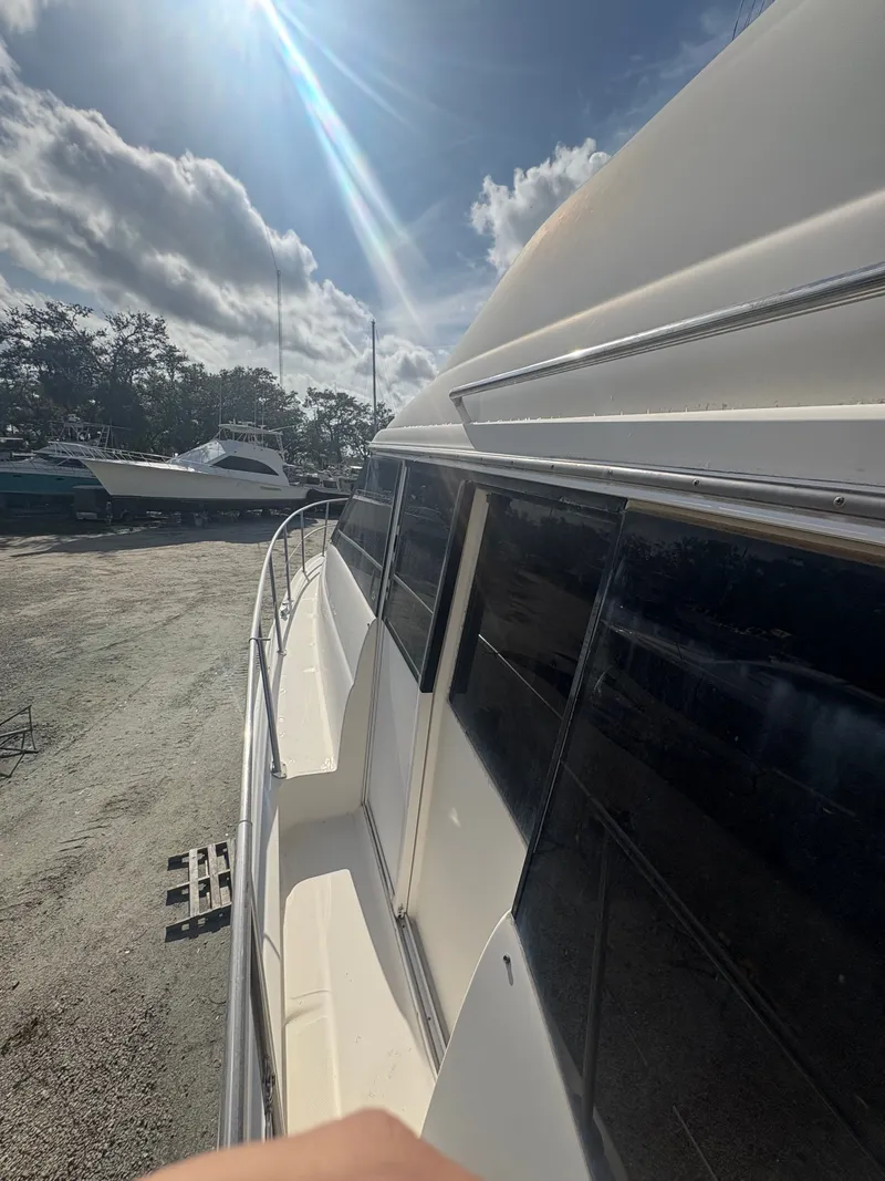 Slide: The Image of 2001 Sea Ray Five Forty yacht in dry dock under sunny skies. - 22