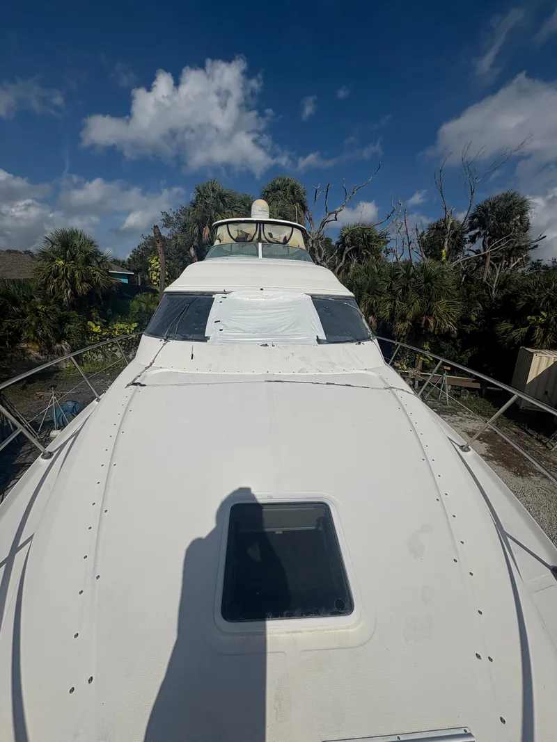 Slide: The Image of 2001 Sea Ray Five Forty yacht outdoors under sunny skies. - 24