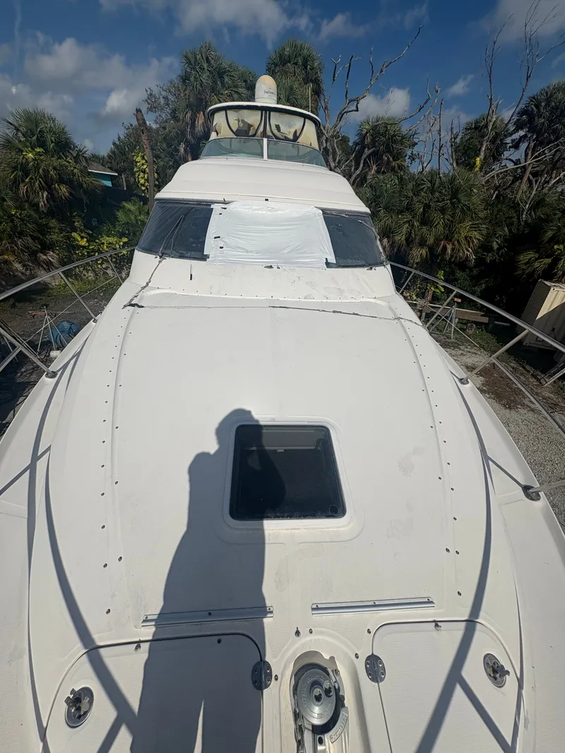 Slide: The Image of 2001 Sea Ray Five Forty yacht in dry dock with shadow. - 25