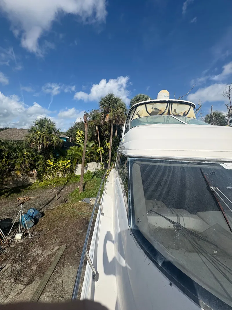 Slide: The Image of 2001 Sea Ray Five Forty yacht in dry dock, blue sky. - 27