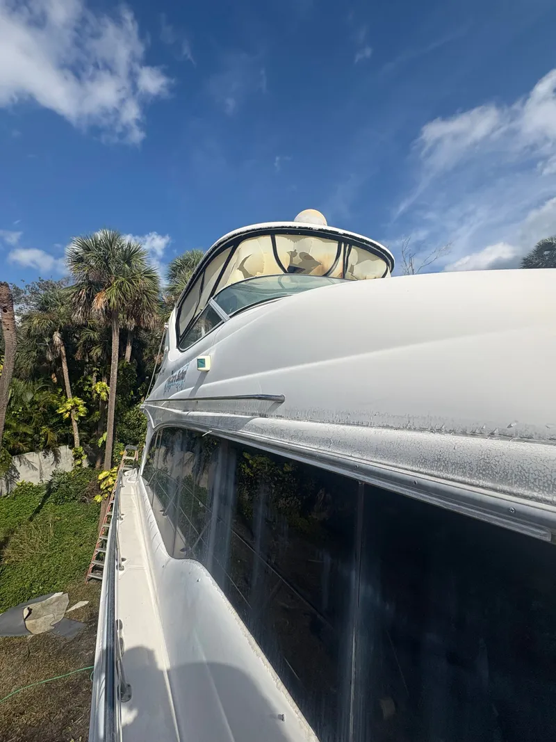 Slide: The Image of 2001 Sea Ray Five Forty yacht under blue sky. - 29