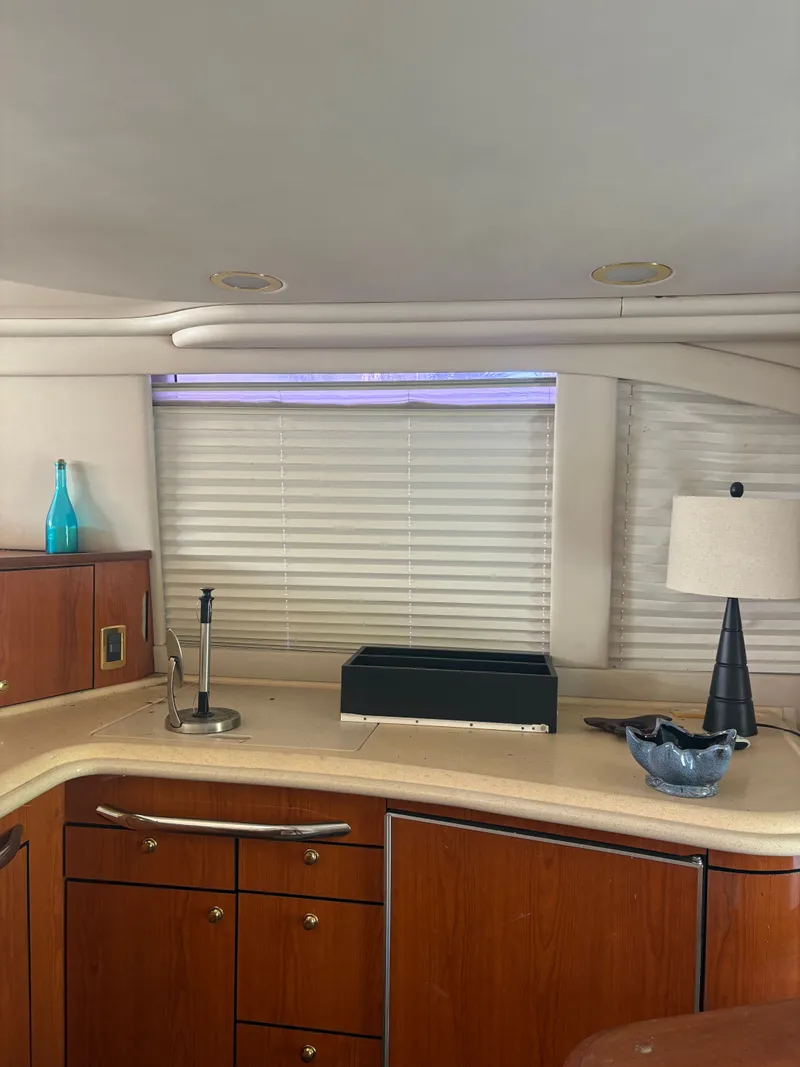 Slide: The Image of Interior of a 2001 Sea Ray Five Forty yacht with elegant wood cabinetry. - 44