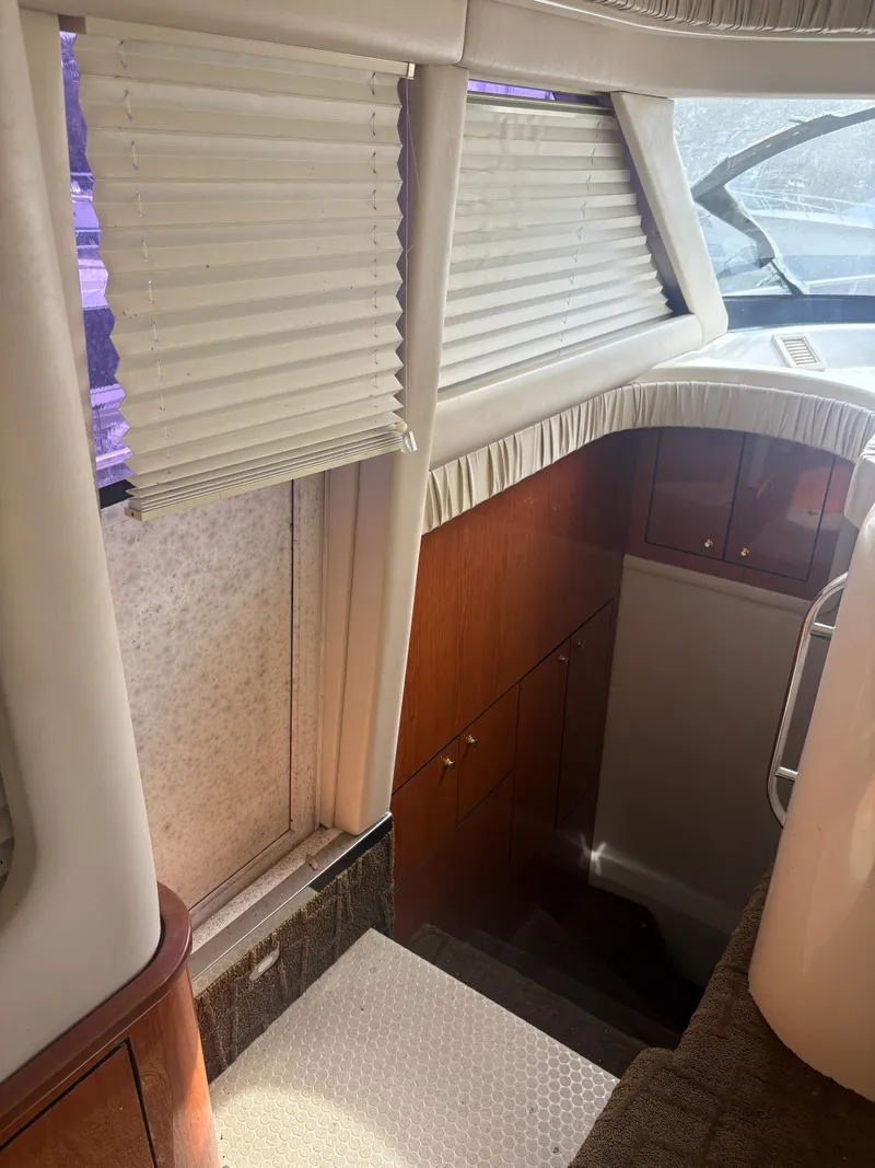 Slide: The Image of Interior of a 2001 Sea Ray Five Forty yacht with stairs and window blinds. - 47