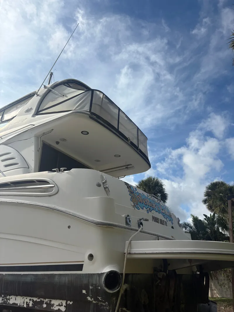 Slide: The Image of 2001 Sea Ray Five Forty yacht under blue sky. - 6