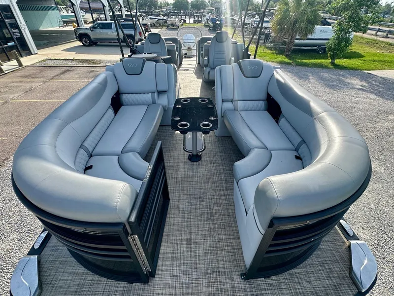 Slide: The Image of Luxurious seating on 2021 Harris Grand Mariner 250 pontoon boat, featuring plush gray upholstery. - 11