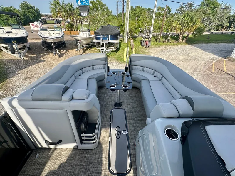 Slide: The Image of 2021 Harris Grand Mariner 250 pontoon boat with spacious seating and modern design. - 14