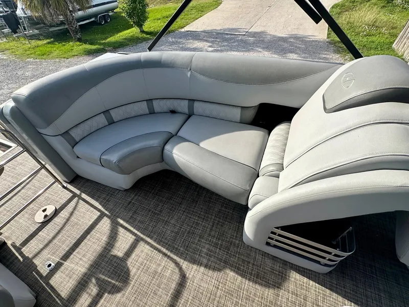 Slide: The Image of Luxurious seating on 2021 Harris Grand Mariner 250 pontoon boat, featuring plush gray upholstery. - 19