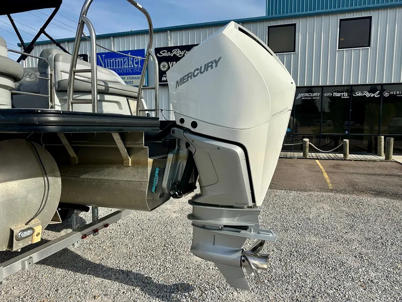 Slide: The Image of 2021 Harris Grand Mariner 250 with Mercury outboard motor in a dealership lot. - 3