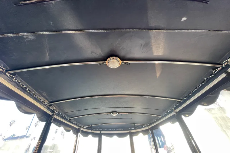 Slide: The Image of Interior roof of a 2017 ElectraCraft 18 LS boat with metal supports. - 11