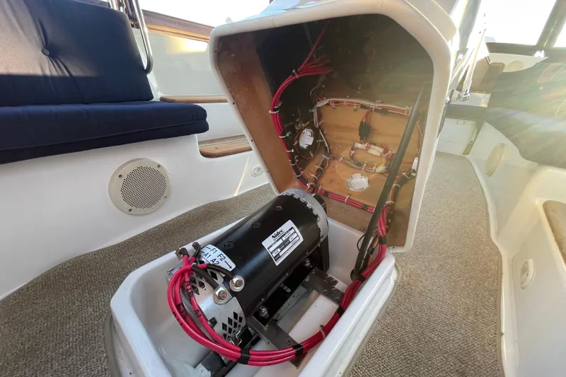Slide: The Image of 2017 ElectraCraft 18 LS boat interior showing motor and wiring details. - 13